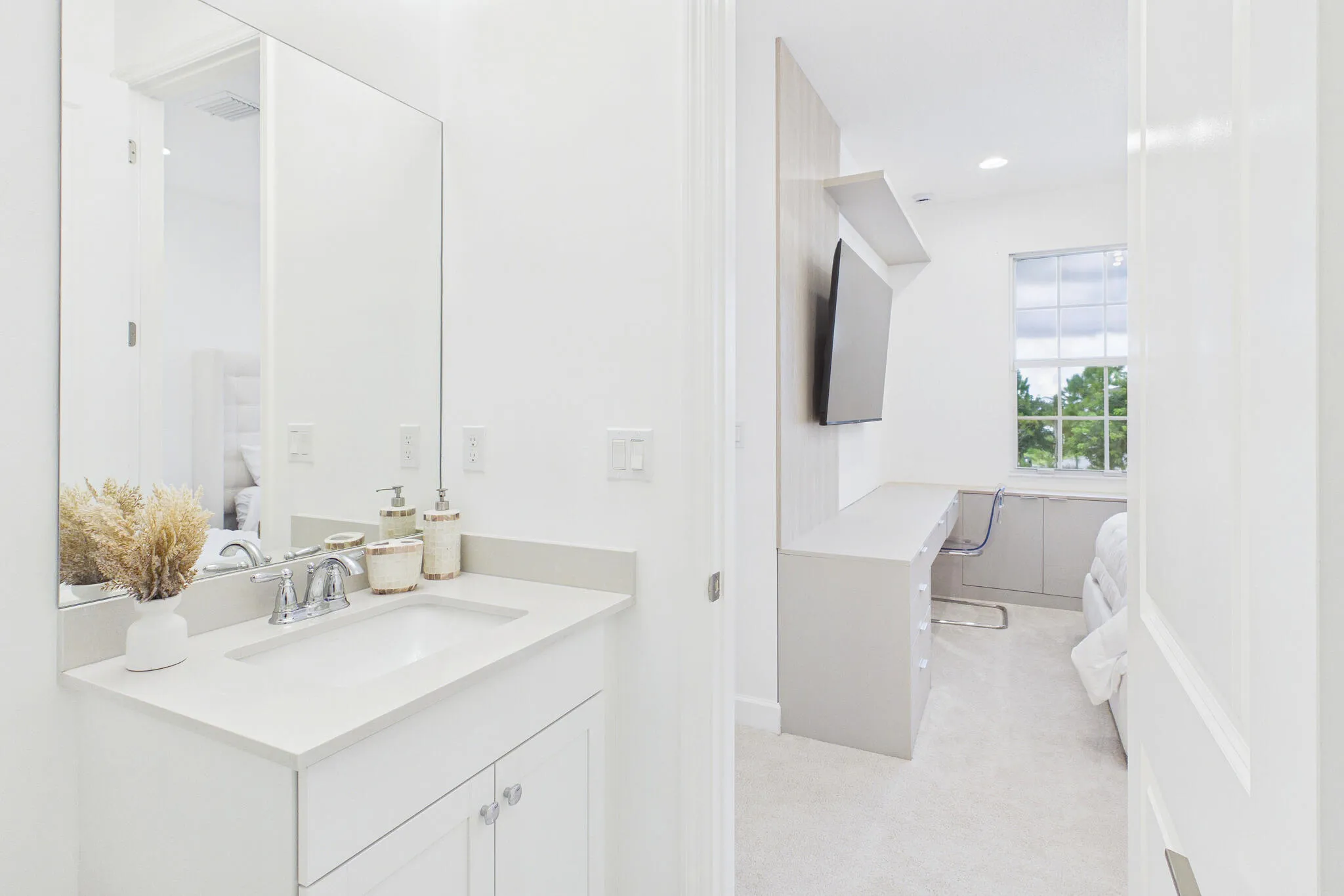 Bathroom vanity with an undermount sink and polished chrome faucet