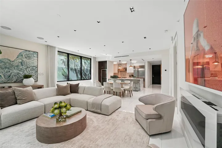 Expansive and effortlessly elegant . Floor to ceiling windows flood the room