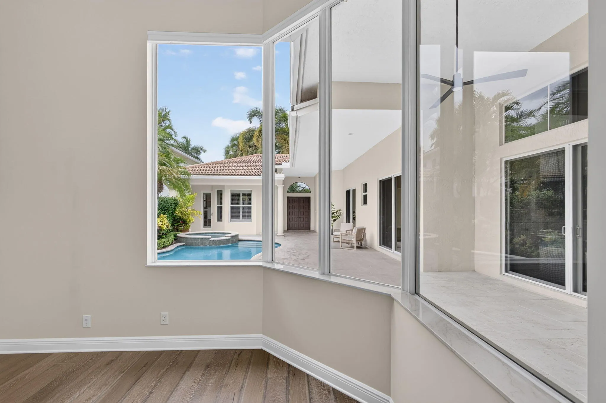 Easy to work from this space with a serene view of the pool