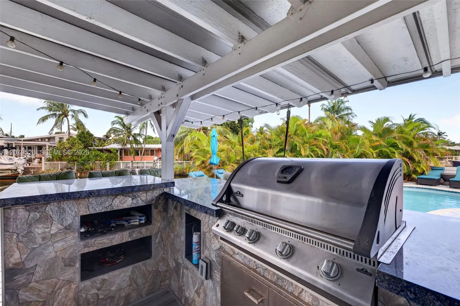 Outdoor Kitchen w/ Grill, Sink, Covered Seating, TV hookup