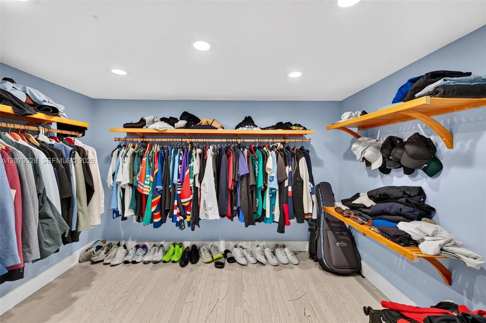 Oversized primary bedroom w/ beamed ceiling, Plantation Shutters and large walk in closet, en suite bathroom, on main level