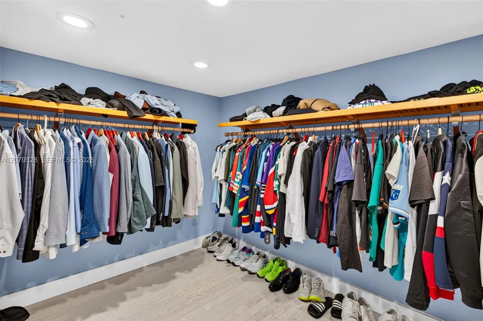 Oversized primary bedroom w/ beamed ceiling, Plantation Shutters and large walk in closet, en suite bathroom, on main level