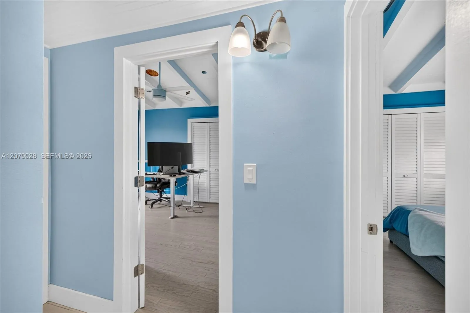 View from hallway at top of stairs toward the two guest bedrooms