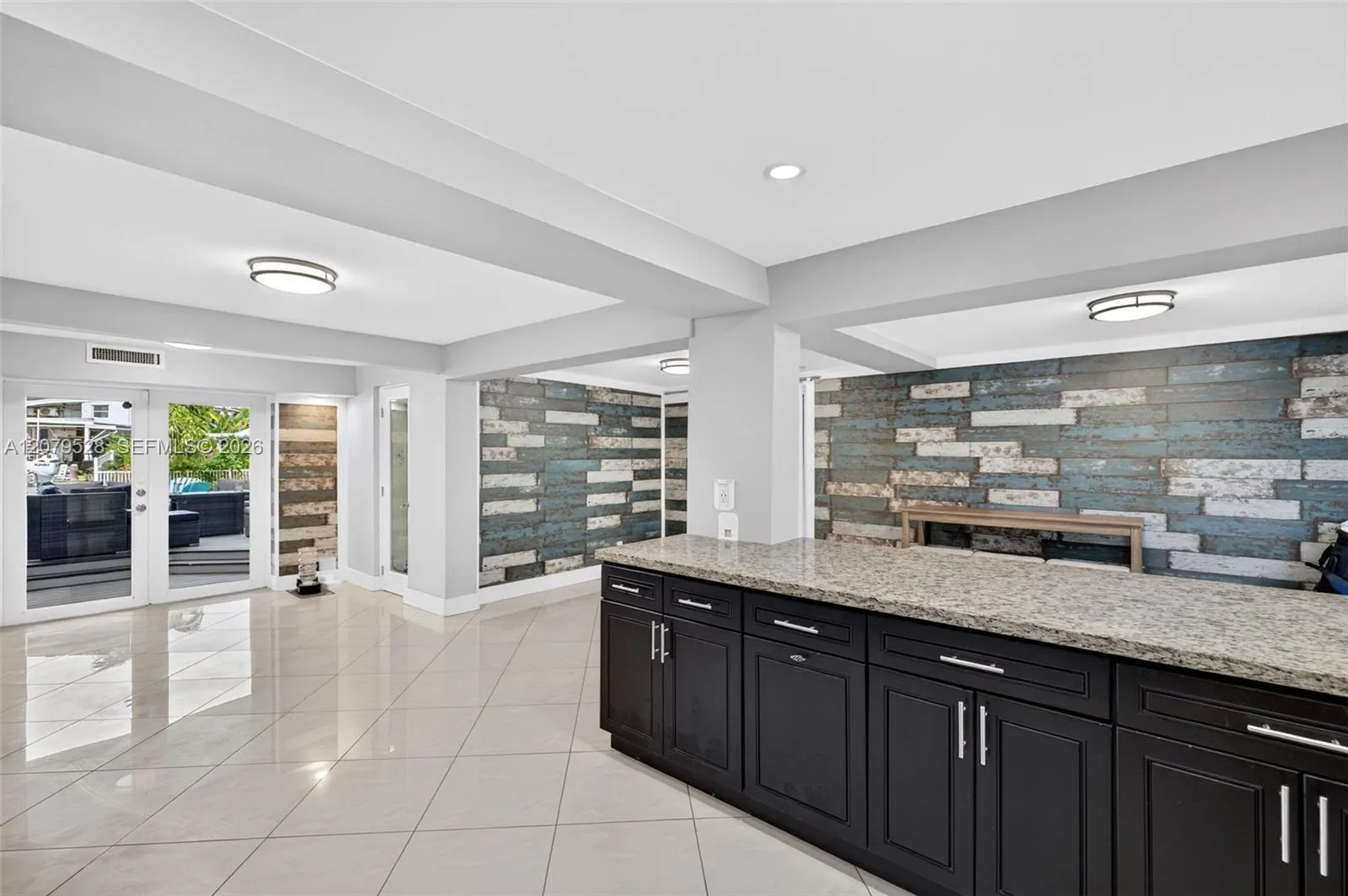 Open kitchen, beyond this space are french doors to pool deck