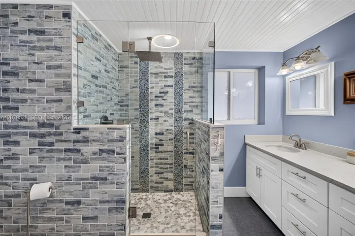 Primary Bathroom, glass shower door and tiled, dual vanity, lovely update