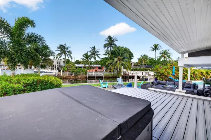 Hot Tub / Beautiful Deck surrounds pool area - upper deck leading from the Florida Room on Main Level