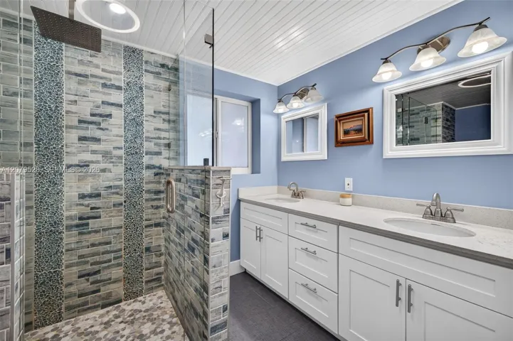 Primary Bathroom, glass shower door and tiled, dual vanity, lovely update