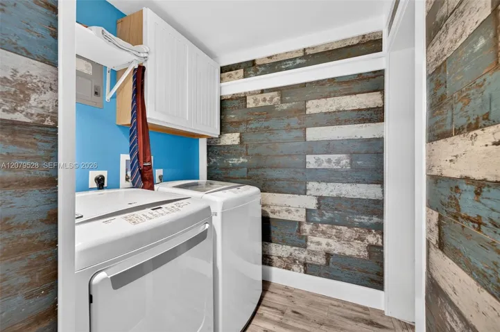 Laundry rm which leads to the downstairs bedroom