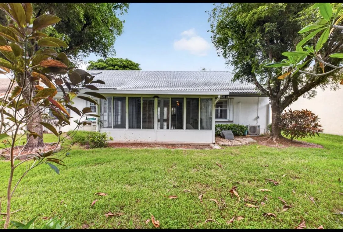 Spacious backyard with mature landscaping and room to create your own outdoor retreat.