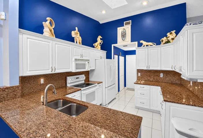 Functional kitchen with generous storage and counter space.