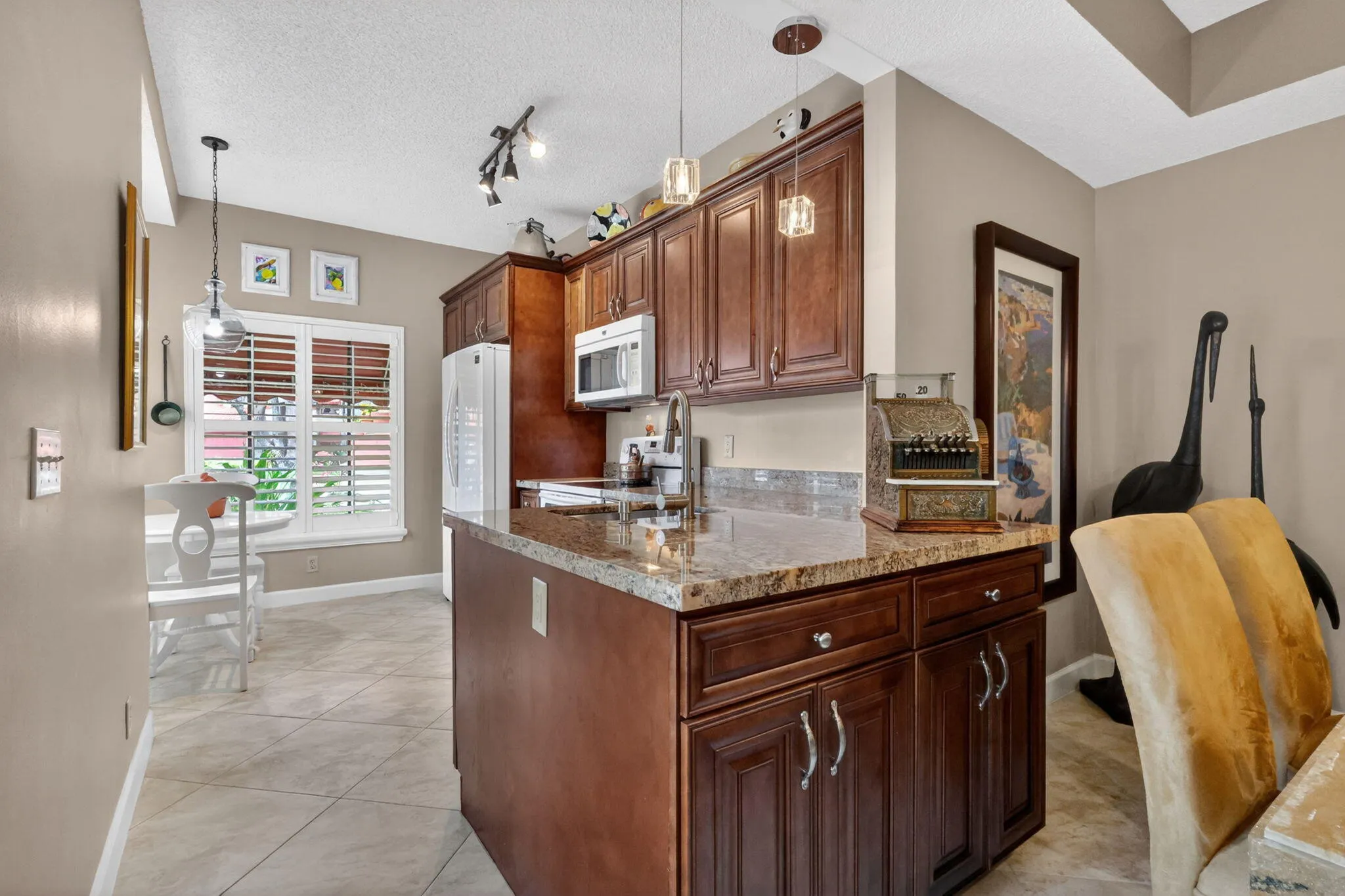 Updated kitchen with wall removed and an additional counter added for more work space.