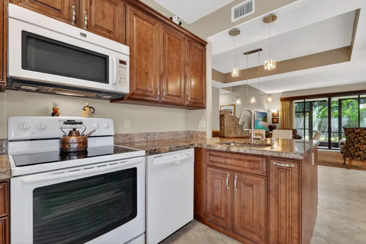 Updated kitchen with wall removed and an additional counter added for more work space.