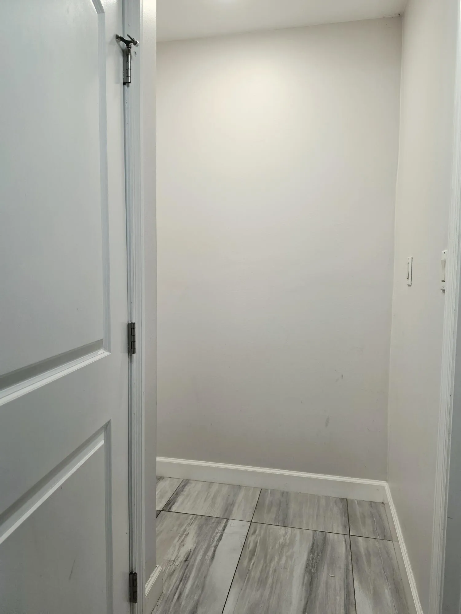 HALLWAY THAT HOUSES YOUR WASHER & DRYER AND LEADS TO YOUR BATHROOM