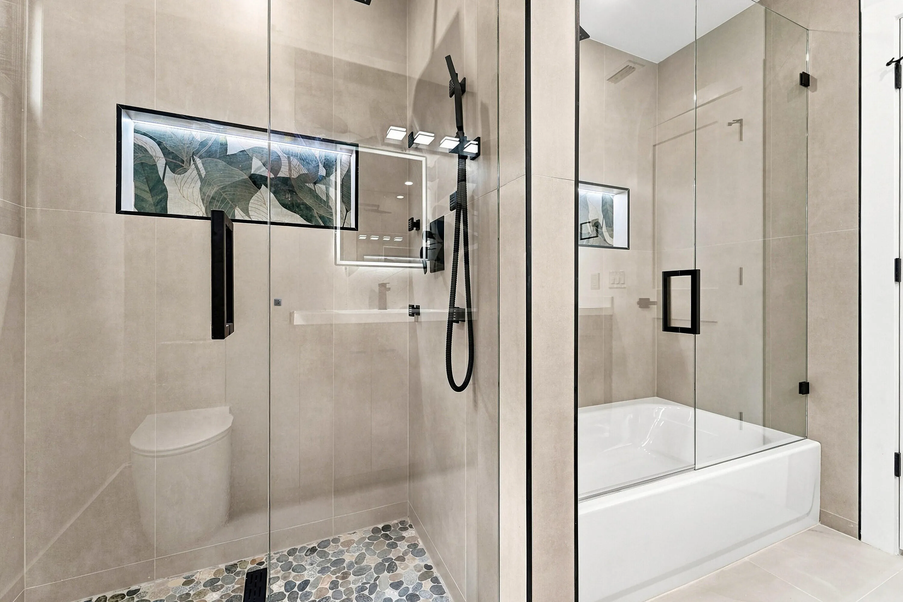 Bath 1 -Shower and tub with lighted niche.
