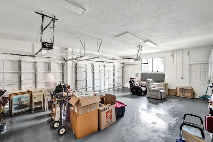 3 car garage with impact doors, cabinets