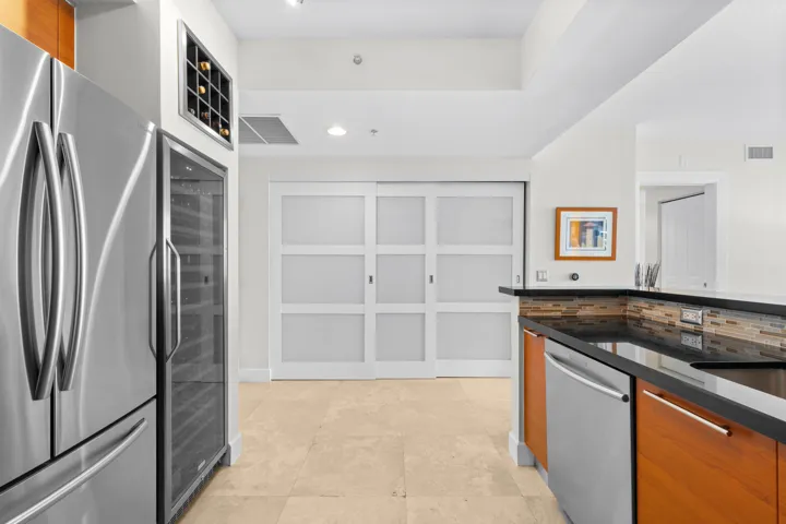 Kitchen & Laundry Closet behind sliding doors.
