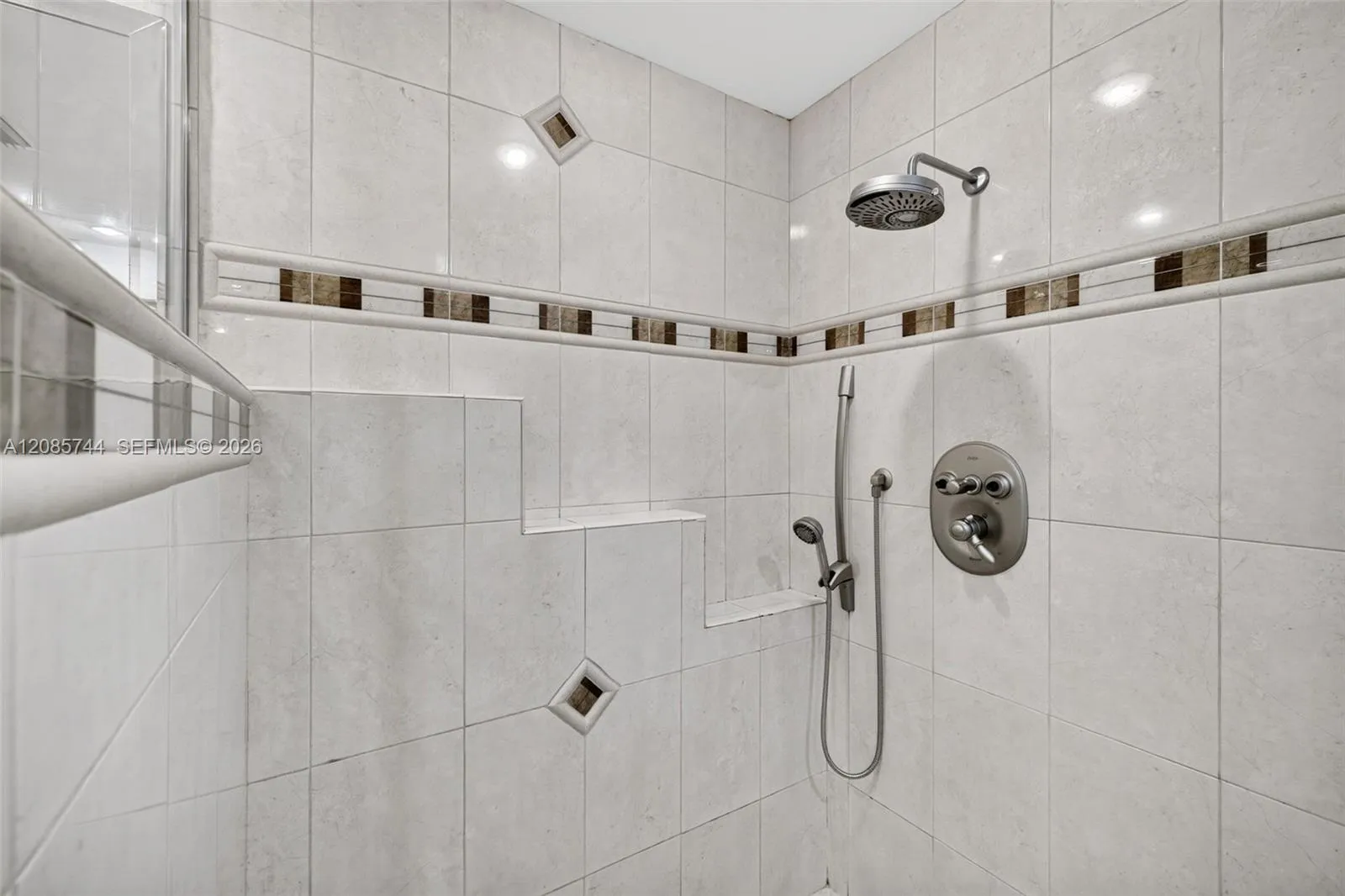 Primary Bath shower w/ frameless shower enclosure and tile to the ceiling. Primary Bath shower w/ frameless shower enclosure and tile to the ceiling.