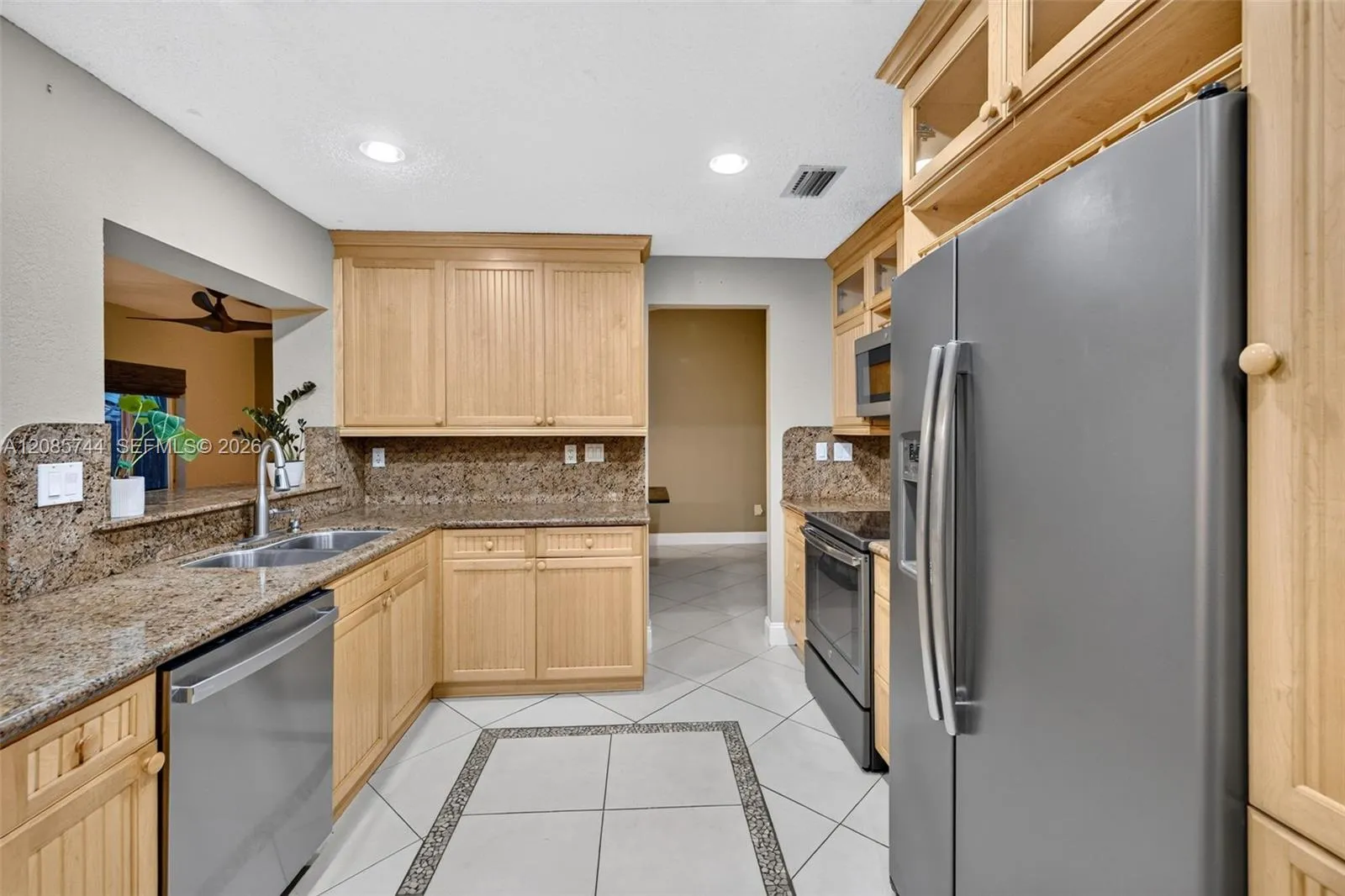 Updated kitchen w/ stainless appliances and wood cabinets, granite counters Updated kitchen w/ stainless appliances and wood cabinets, granite counters