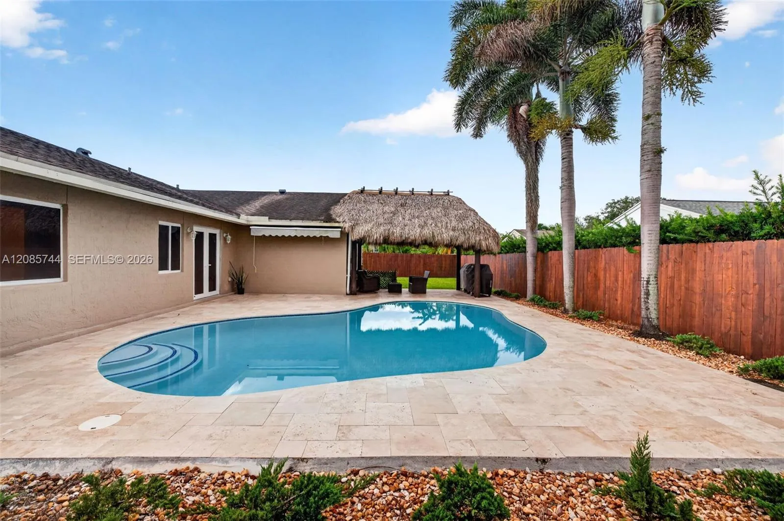 Gorgeous recently resurfaced pool w/ travertine decking, fully fenced, w/ amazing tiki hut, recently rethatched and new sprinkler pump Gorgeous recently resurfaced pool w/ travertine decking, fully fenced, w/ amazing tiki hut, recently rethatched and new sprinkler pump