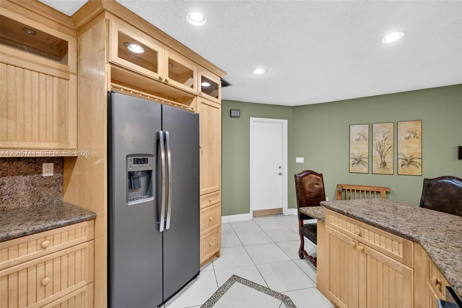 Updated kitchen w/ stainless appliances and wood cabinets, granite counters Updated kitchen w/ stainless appliances and wood cabinets, granite counters