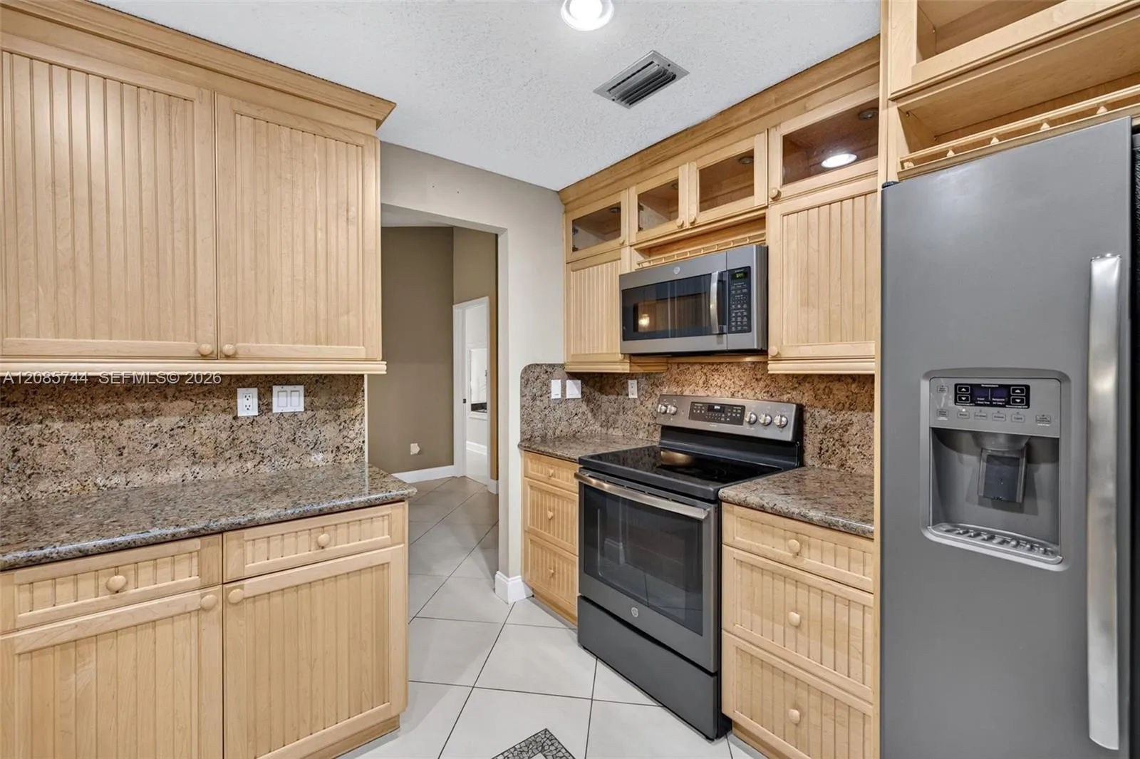 Updated kitchen w/ stainless appliances and wood cabinets, granite counters Updated kitchen w/ stainless appliances and wood cabinets, granite counters