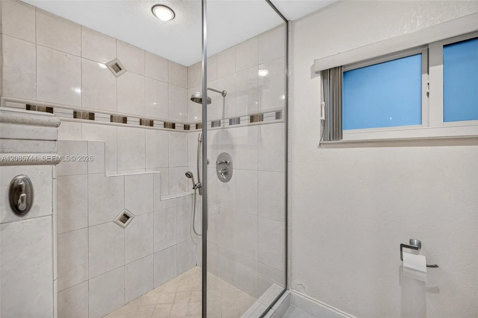 Primary Bath shower w/ frameless shower enclosure and tile to the ceiling. Primary Bath shower w/ frameless shower enclosure and tile to the ceiling.