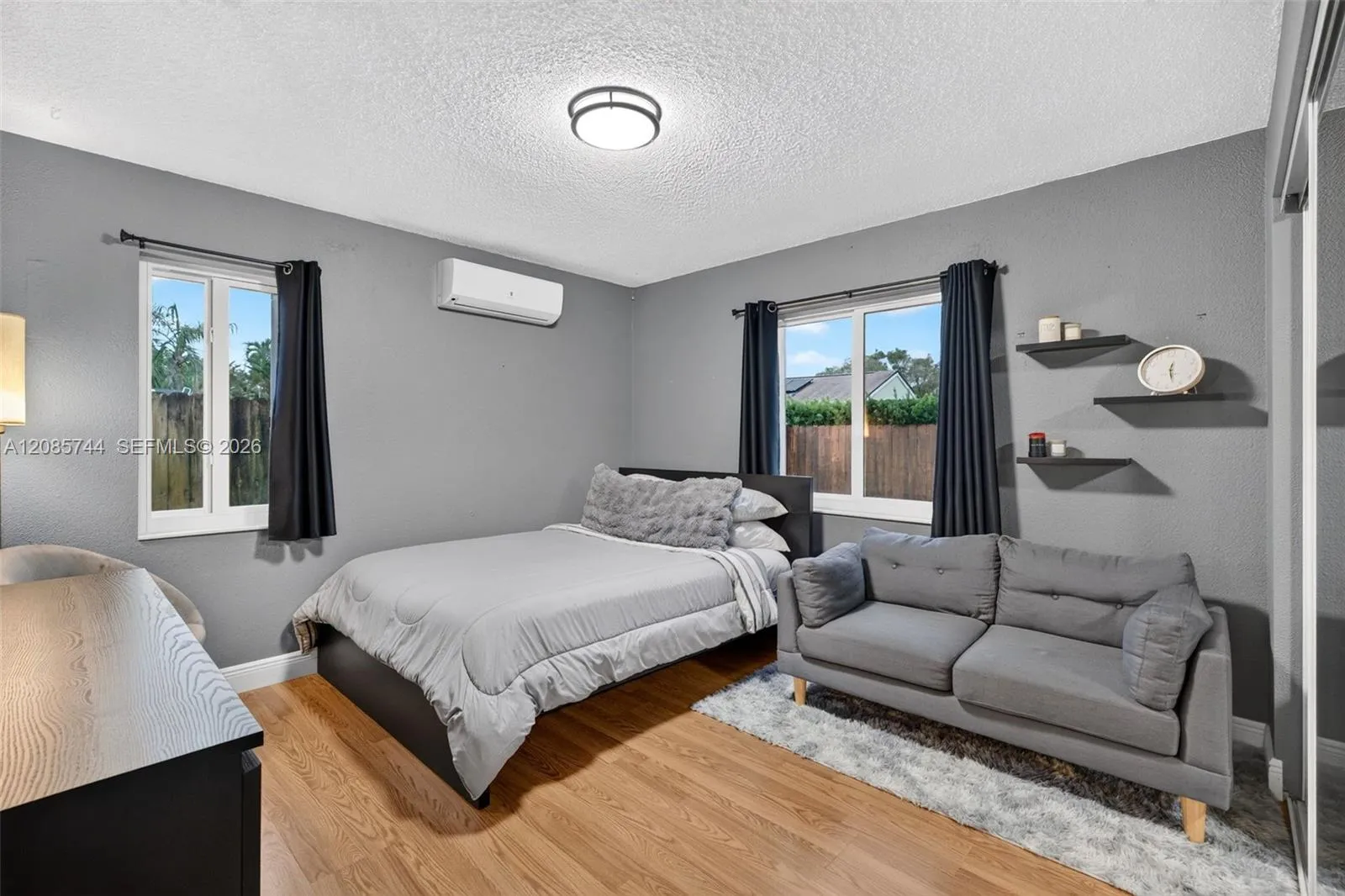 Guest bedroom overlooking backyard / side yard. Laminate floors plus a recently installed extra mini split AC to keep it very cool! Guest bedroom overlooking backyard / side yard. Laminate floors plus a recently installed extra mini split AC to keep it very cool!