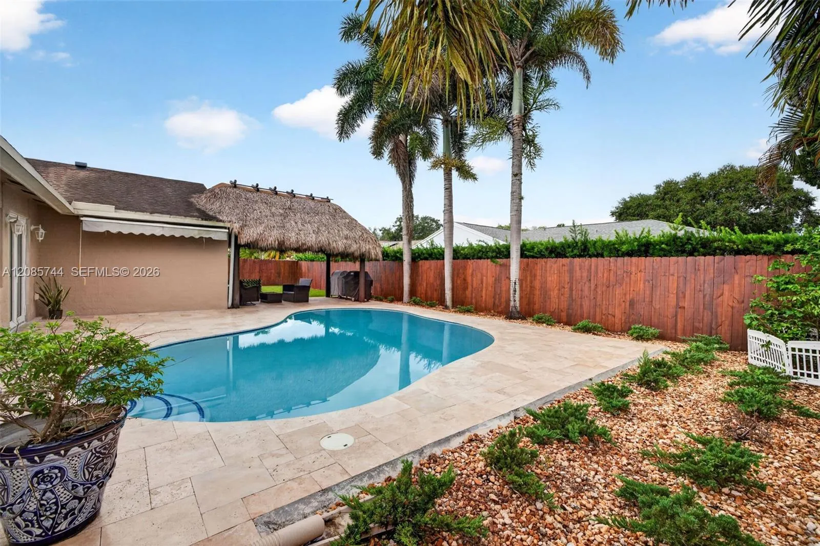 Gorgeous recently resurfaced pool w/ travertine decking, fully fenced, w/ amazing tiki hut, recently rethatched and new sprinkler pump Gorgeous recently resurfaced pool w/ travertine decking, fully fenced, w/ amazing tiki hut, recently rethatched and new sprinkler pump