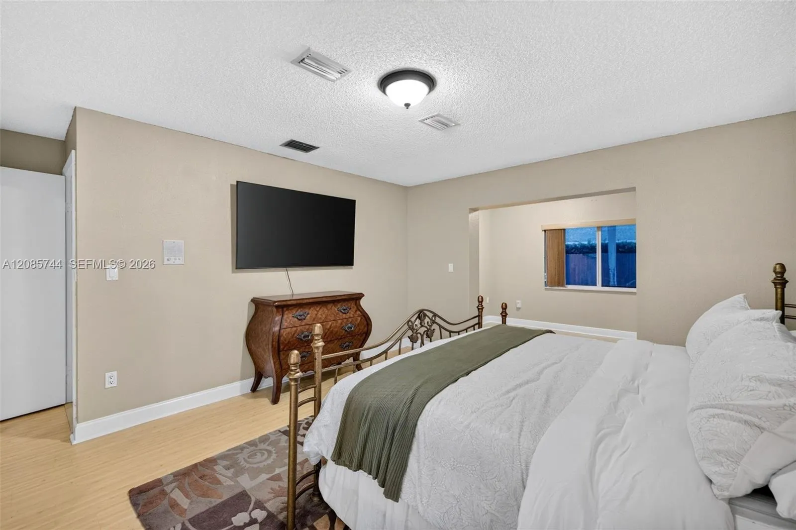 Oversized Primary bedroom w/ sitting area / office / library / nursery / gym add on w/ view to pool area. Laminate floors Oversized Primary bedroom w/ sitting area / office / library / nursery / gym add on w/ view to pool area. Laminate floors