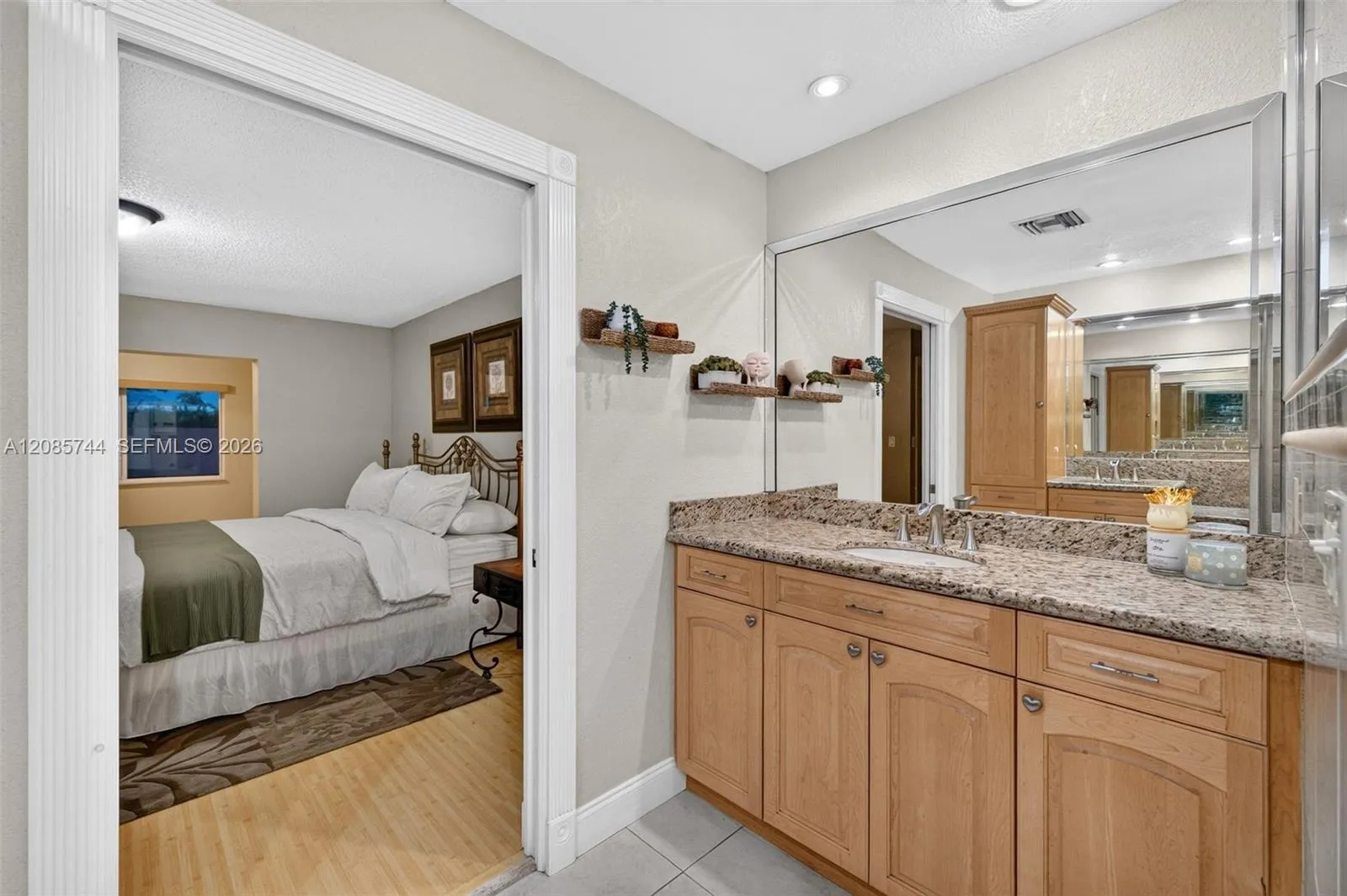 Ensuite bathroom w/ dual vanities w/ vanity area, stall shower & wood cabinets Ensuite bathroom w/ dual vanities w/ vanity area, stall shower & wood cabinets