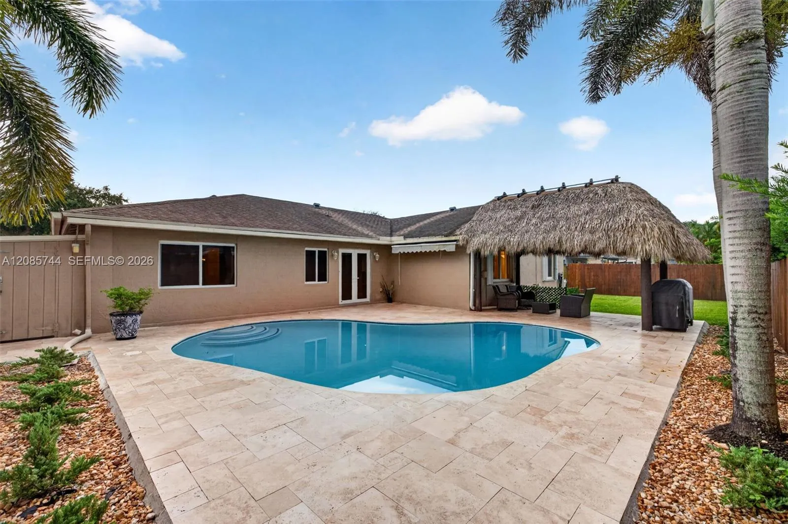 Gorgeous recently resurfaced pool w/ travertine decking, fully fenced, w/ amazing tiki hut, recently rethatched and new sprinkler pump Gorgeous recently resurfaced pool w/ travertine decking, fully fenced, w/ amazing tiki hut, recently rethatched and new sprinkler pump