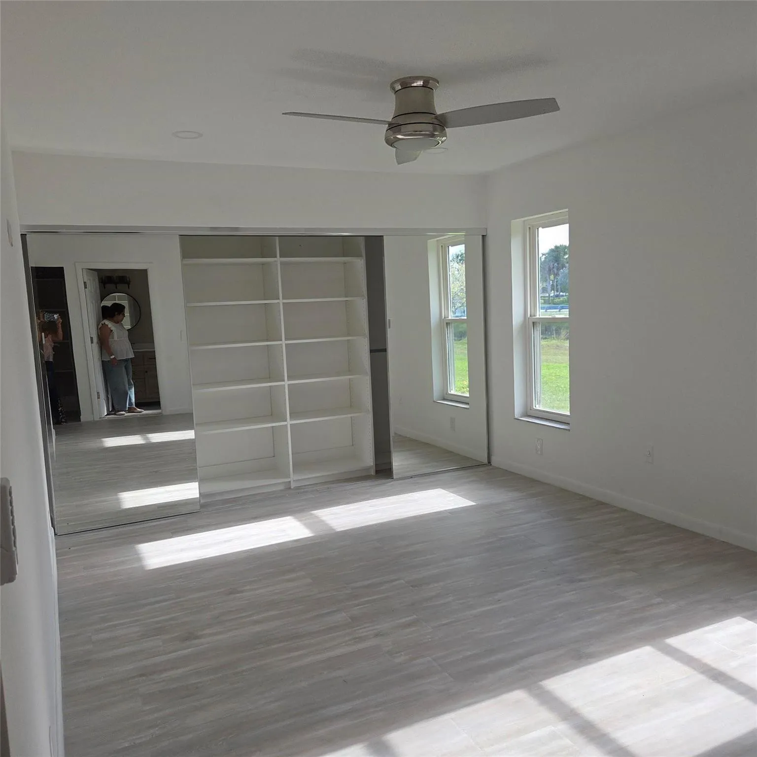 Very large, built out closet, 2 windows, new floors and fan