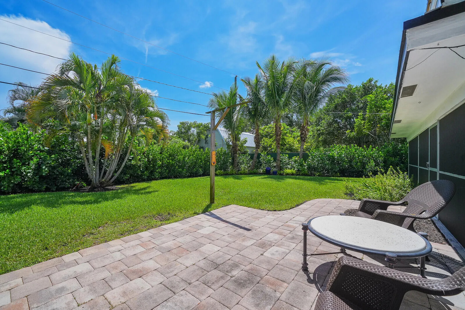 COMPLETELY FENCED IN WITH TROPICAL LANDSCAPING