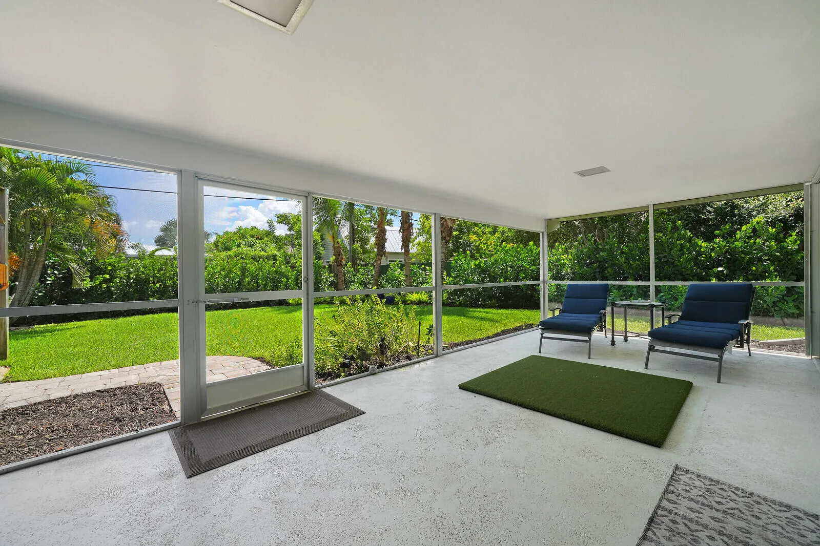 LARGE COVERED AND SCREENED PATIO SPACE