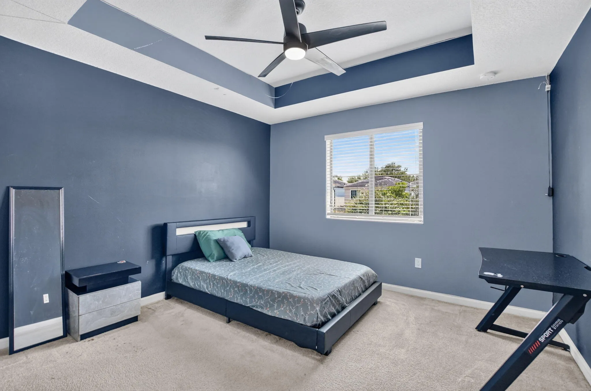 Guest bedroom with bright and cheery window.