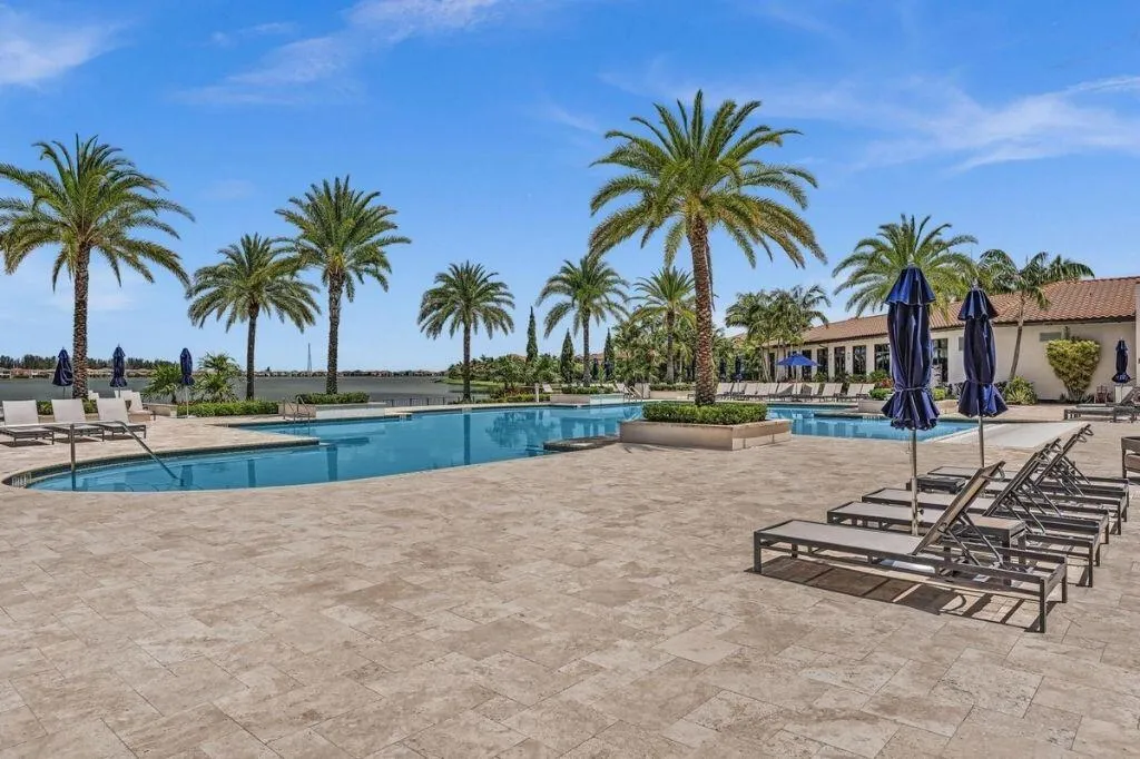 Outdoor swimming pool with integrated spa and spacious surrounding patio