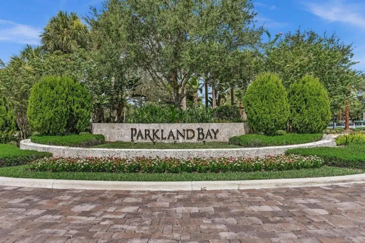 Stone entrance monument featuring "PARKLAND BAY" lettering