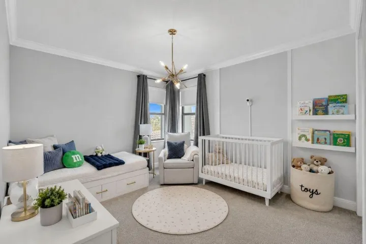 Room featuring light grey walls and crown molding
