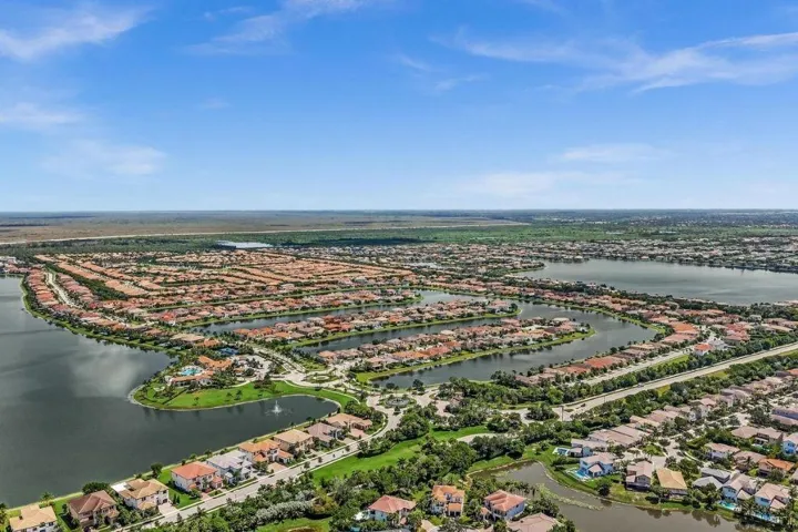 Expansive aerial capturing a master-planned community featuring numerous residential properties