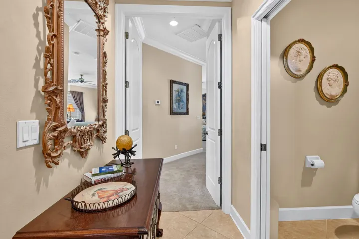 Beige wall paint, white trim, and tiled flooring