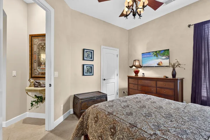 Ornate chandelier and ceiling fan
