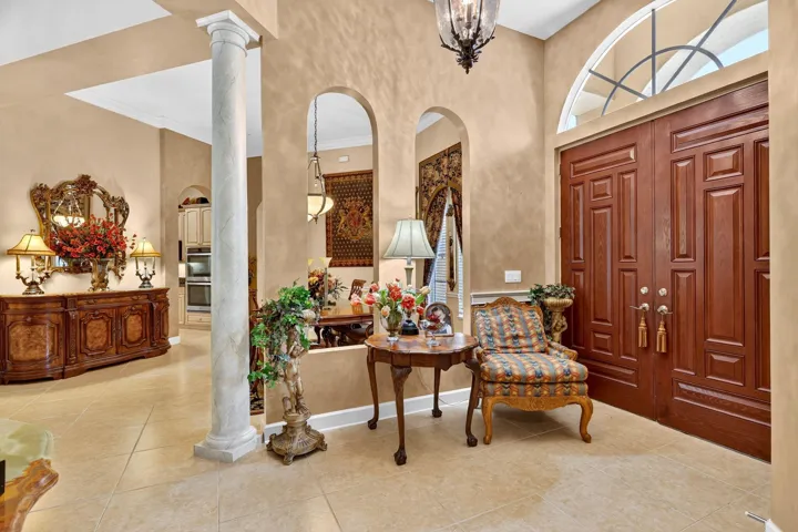 Double entry doors with an arched transom window