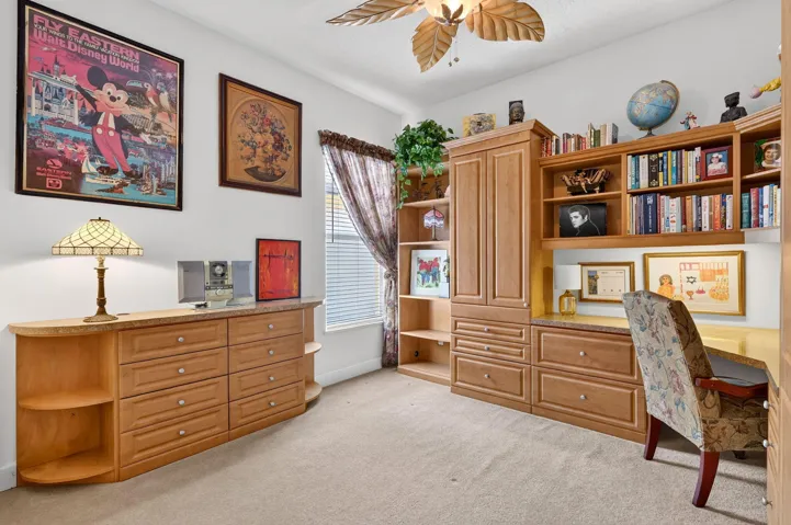 Built-in desk with overhead shelving, integrated cabinetry, expandable desk
