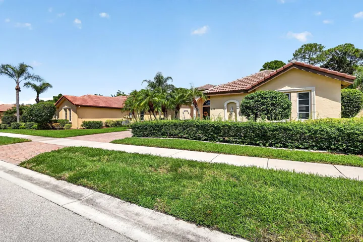Mediterranean-style architecture with tile roofing and stucco exterior