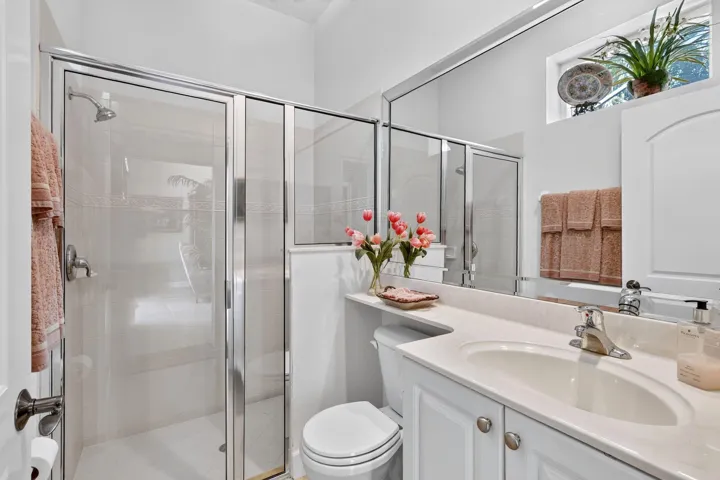 Glass-enclosed shower with a chrome showerhead
