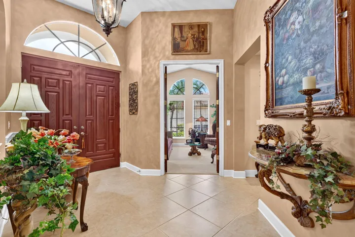Double entry doors with an arched transom window