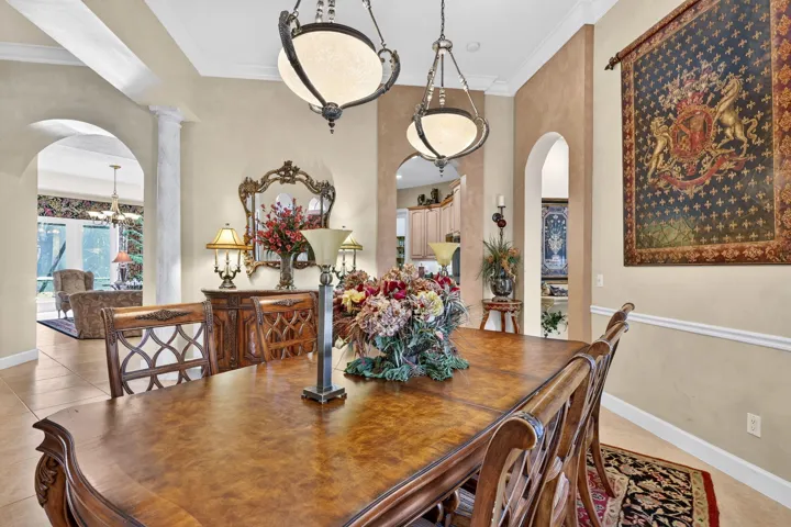 High ceiling with crown molding and recessed lighting