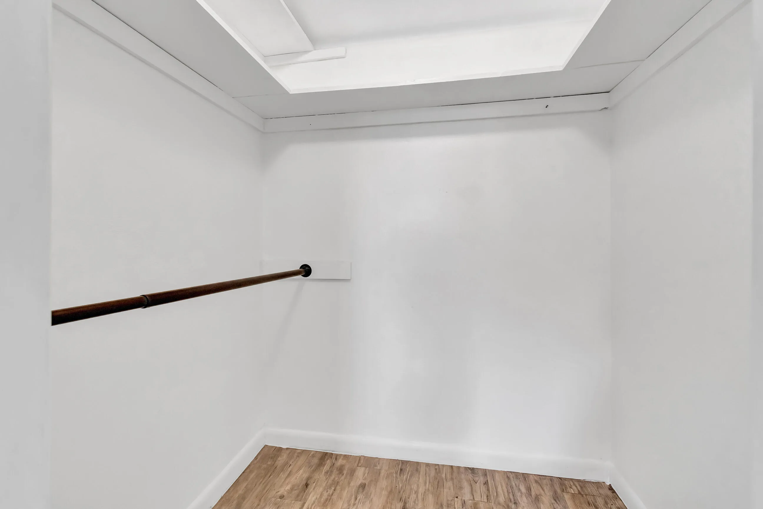 Integrated hanging rod and wood-finish flooring