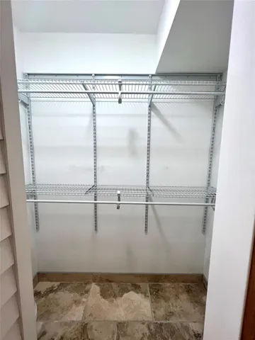 PRIMARY BEDROOM WALKING CLOSET