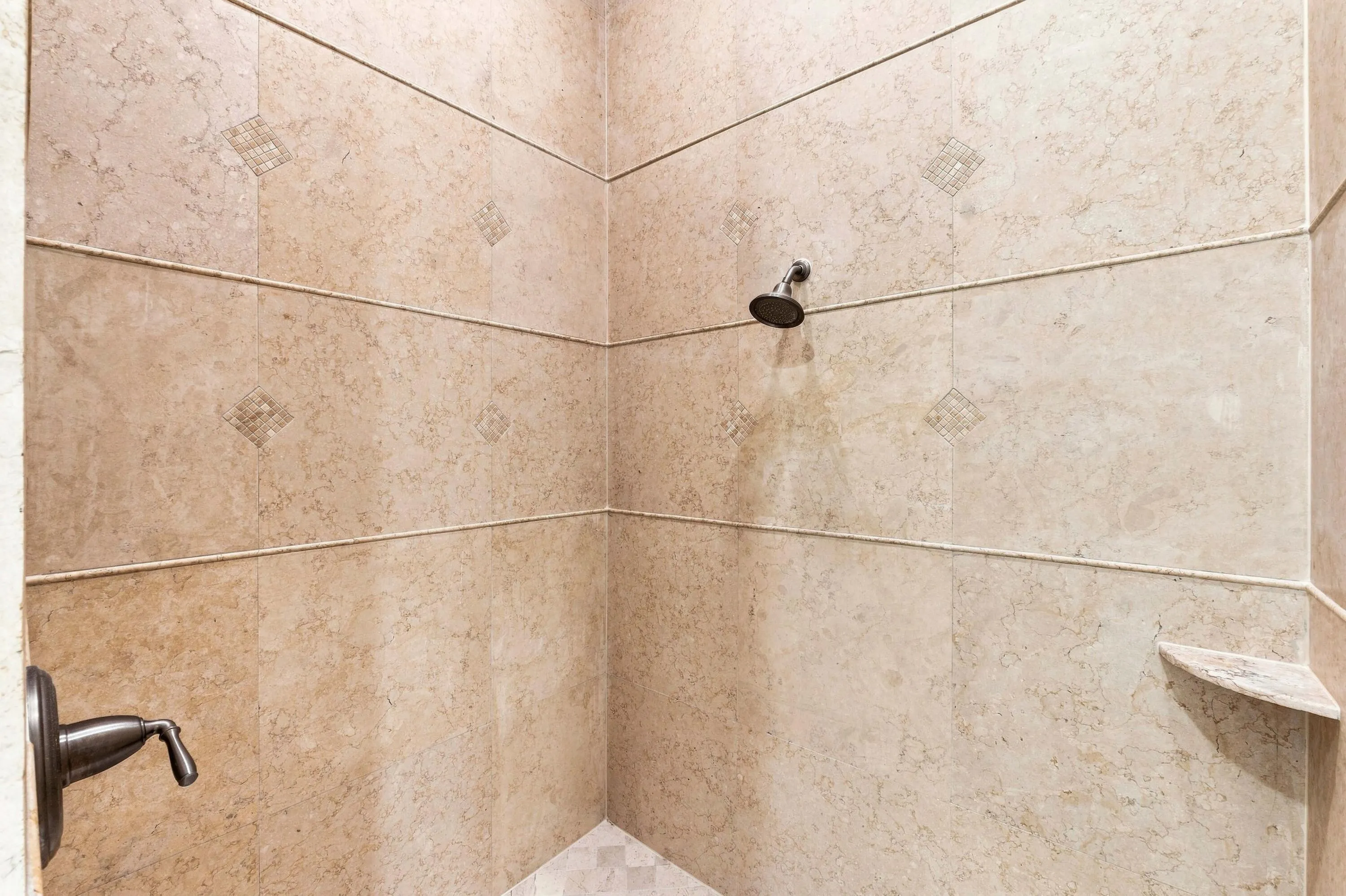Updated tile shower with modern finishes